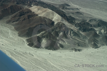 Aerial astronaut mountain nazca lines geoglyph.