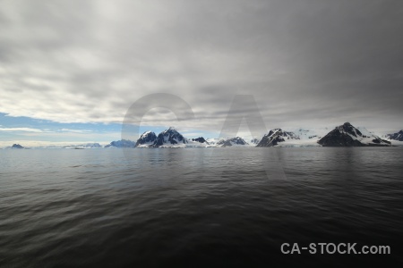 Antarctic peninsula snowcap cloud ice sea.