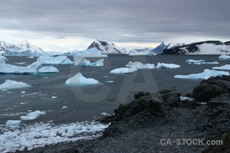 Antarctica cruise square bay iceberg mountain rock.