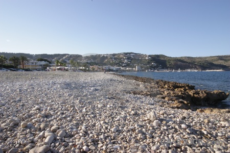 Beach europe stone javea sea.