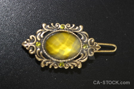Black jewellry yellow object.
