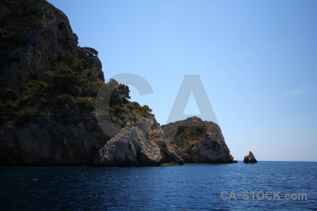 Blue sea javea rock cliff.