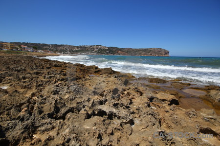 Blue sky javea sea rock.