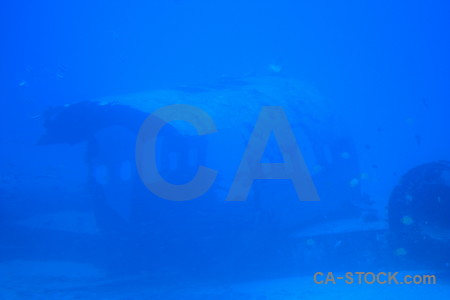 Blue underwater wreck.