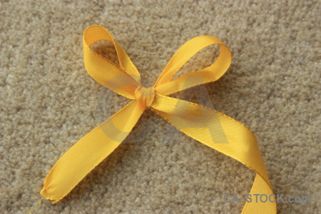 Brown ribbon object yellow orange.