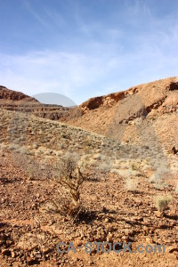 Brown rock orange mountain desert.