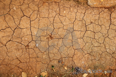 Brown soil orange texture crack.