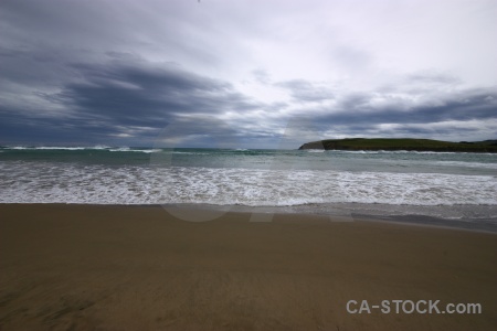 Catlins sand wave beach water.