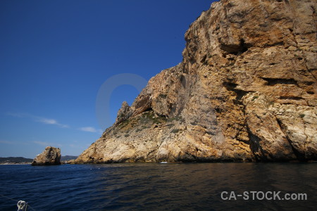 Cliff brown sea europe blue.