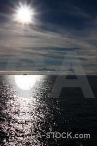 Cloud antarctica cruise sea sun sunrise.