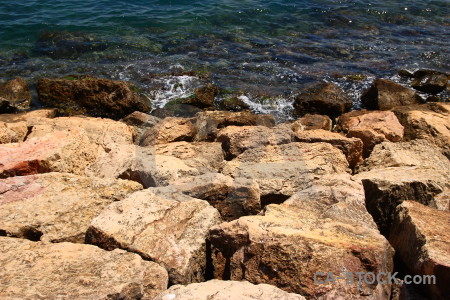 Coast sea brown rock water.