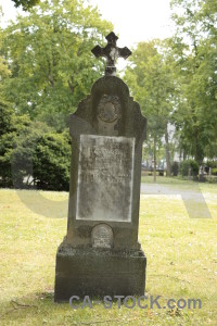 Cross grave green cemetery statue.