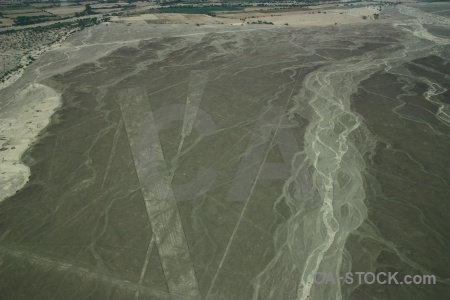 Flying aerial triangle nazca lines south america.