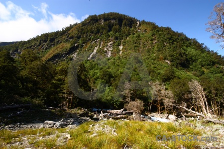 Grass cloud new zealand rock mountain.