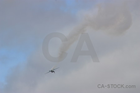 Gray smoke airplane.