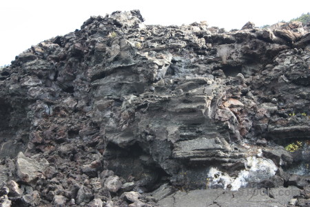 Gray volcanic cliff lava white.