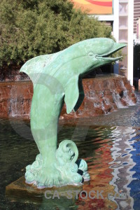 Green dolphin animal statue.