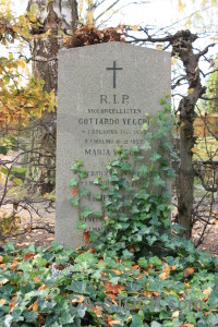 Green grave cemetery cross statue.