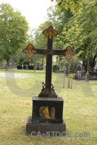 Green grave cross statue cemetery.