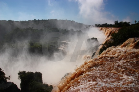 Iguazu river waterfall south america tree spray.