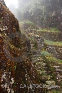 Inca ruin rock altitude fog.