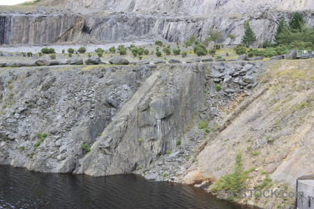 Lake cliff gray water rock.
