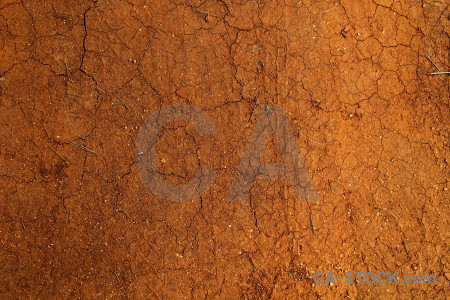 Orange brown texture crack soil.