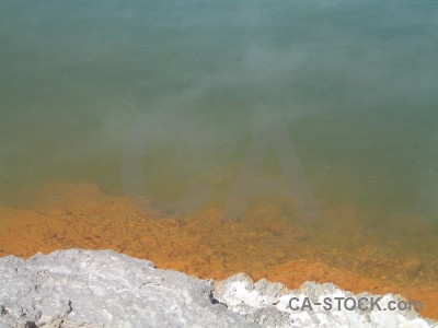 Orange volcanic water lake brown.