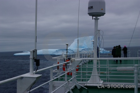 Person boat iceberg day 4 sky.