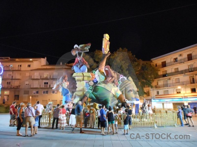 Person building fiesta javea statue.