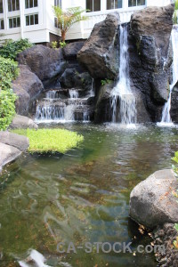 Pool waterfall green water.