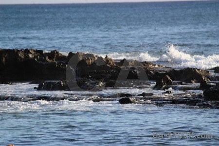 Rock water surface sea.