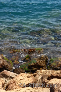 Sea coast blue water rock.