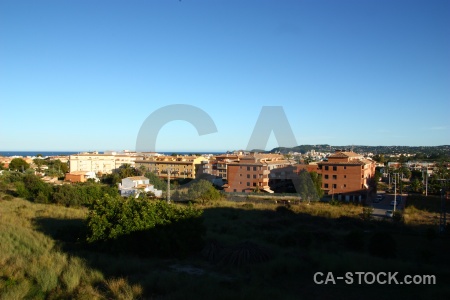 Sky building javea grass tree.