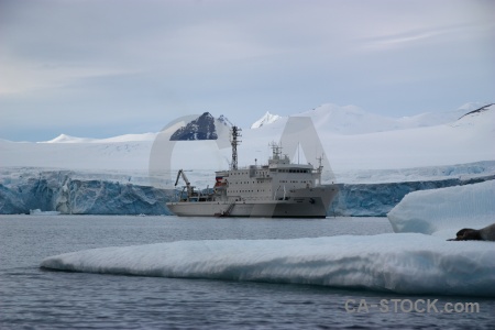 Snowcap sky antarctica cruise water sea.