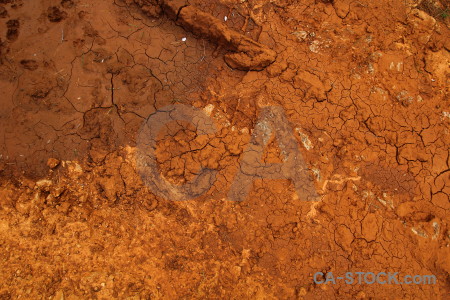 Soil crack brown orange texture.