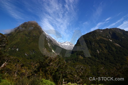 South island cloud snowcap mountain new zealand.