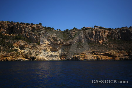 Spain blue javea sea cliff.