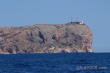 Spain javea blue lighthouse cliff.