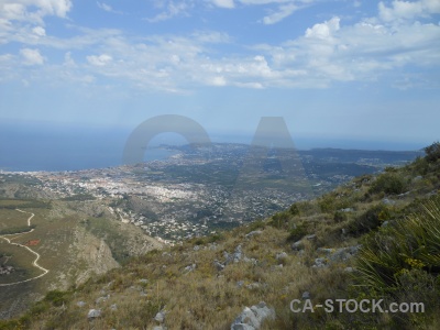 Spain sky rock water sea.