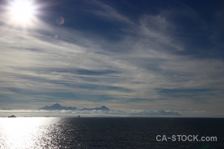 Sun ice mountain water antarctica cruise.