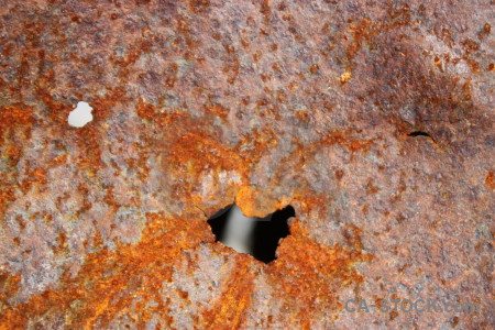 Texture brown hole rust orange.