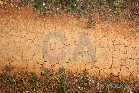 Texture orange crack brown soil.