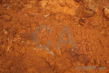 Texture soil crack orange brown.